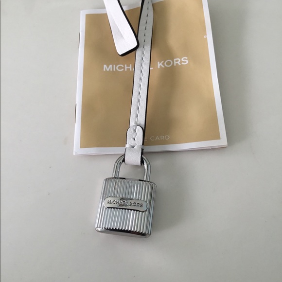 Michael Kors Handbags - New Michael kors silver Lock and white bag charm